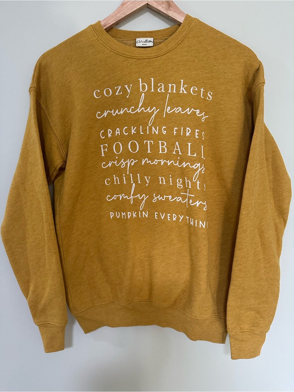 Oat Collective Mustard Crewneck Sweatshirt with White Seasonal Graphic